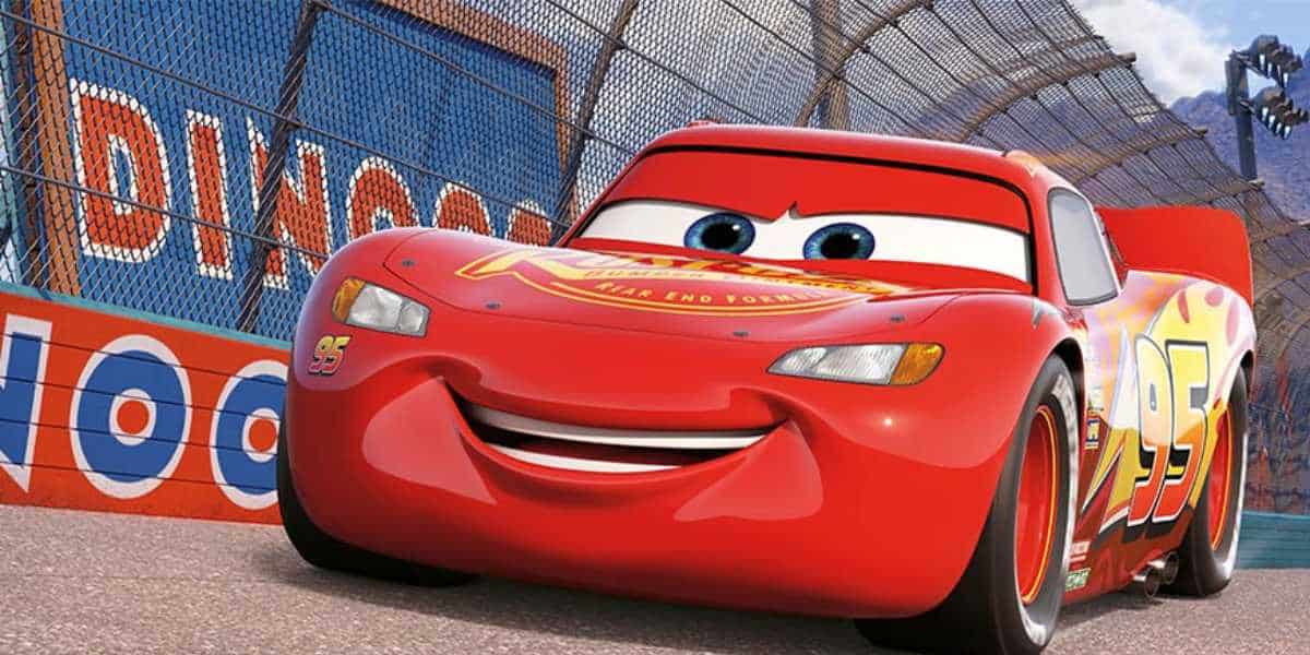 Lightning McQueen, smiling and racing on a track, inspired by the sold-out "Cars" Disney popcorn bucket collectible.