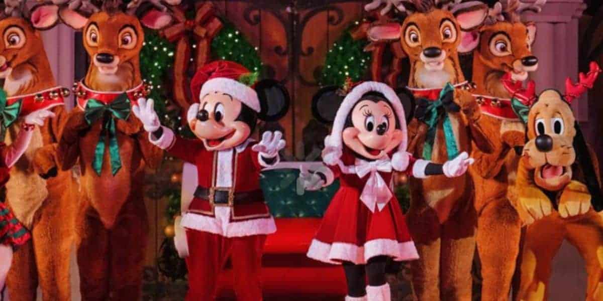Mickey and Minnie Mouse join Pluto and reindeer in sparkling holiday attire amid festive decorations at Disney parks.