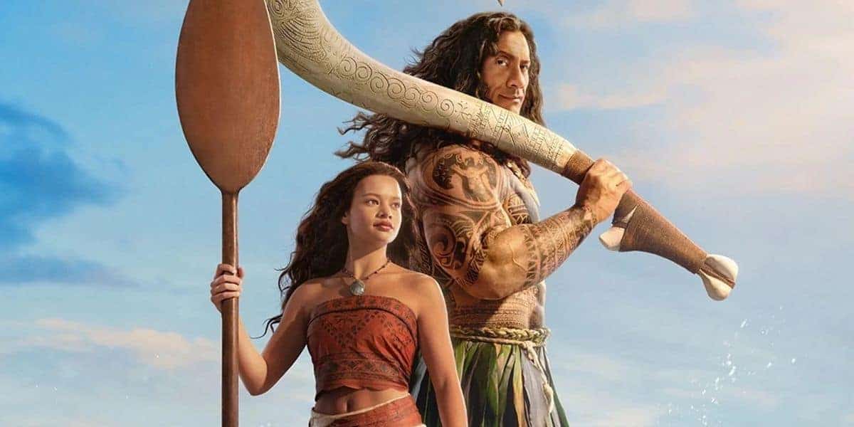 Moana and Maui pose together with Moana’s paddle and Maui’s magical hook, set against a sunny, vibrant sky.