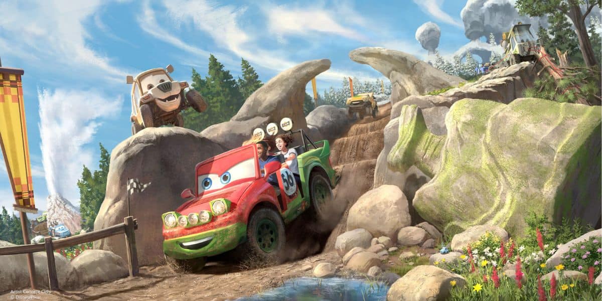 Guests delight as they zoom along a muddy, rocky track in a cheerful, cartoon-style car at the amusement park, surrounded by playful scenery with trees, boulders, and other riders’ cars.