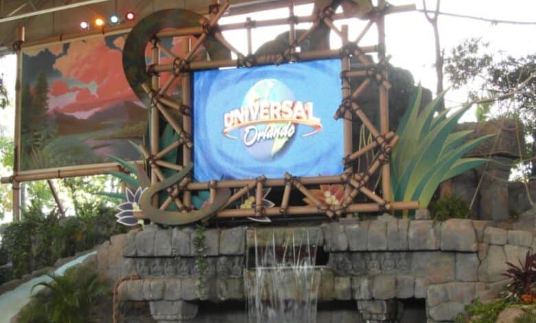 Universal Orlando logo on a bamboo-framed screen at the entrance to an attraction.