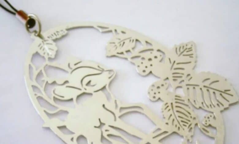 Bambi filigree metal ornament on a hanging cord, a souvenir from a Walt Disney World interactive attraction.