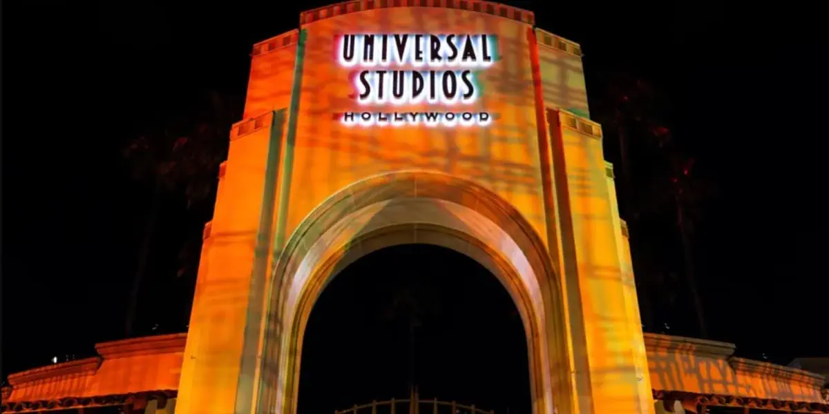 Universal Studios Hollywood entrance arch lit up for Halloween Horror Nights.