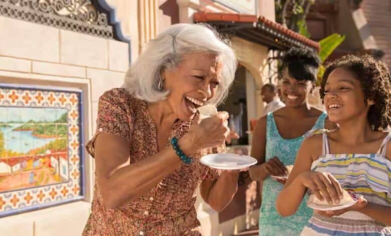 A family enjoying Global Market bites at the EPCOT International Food & Wine Festival.