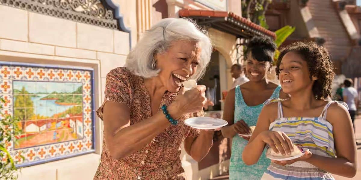 A family enjoying Global Market bites at the EPCOT International Food & Wine Festival.