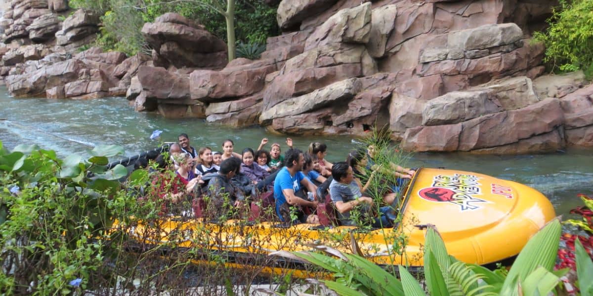 Guests on the Jurassic Park River Adventure at Universal Studios.