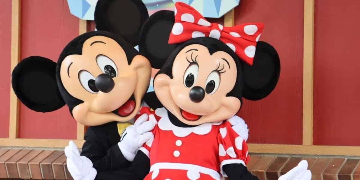 Mickey and Minnie Mouse posing together at Disney World.