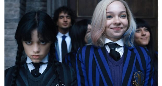 Wednesday Addams and Enid Sinclair in their Nevermore Academy uniforms from Wednesday.