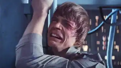 Luke Skywalker clutching a doorway on Cloud City in a scene from Star Wars.
