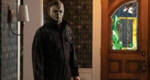 Michael Myers from Halloween (1978) standing in a hallway.