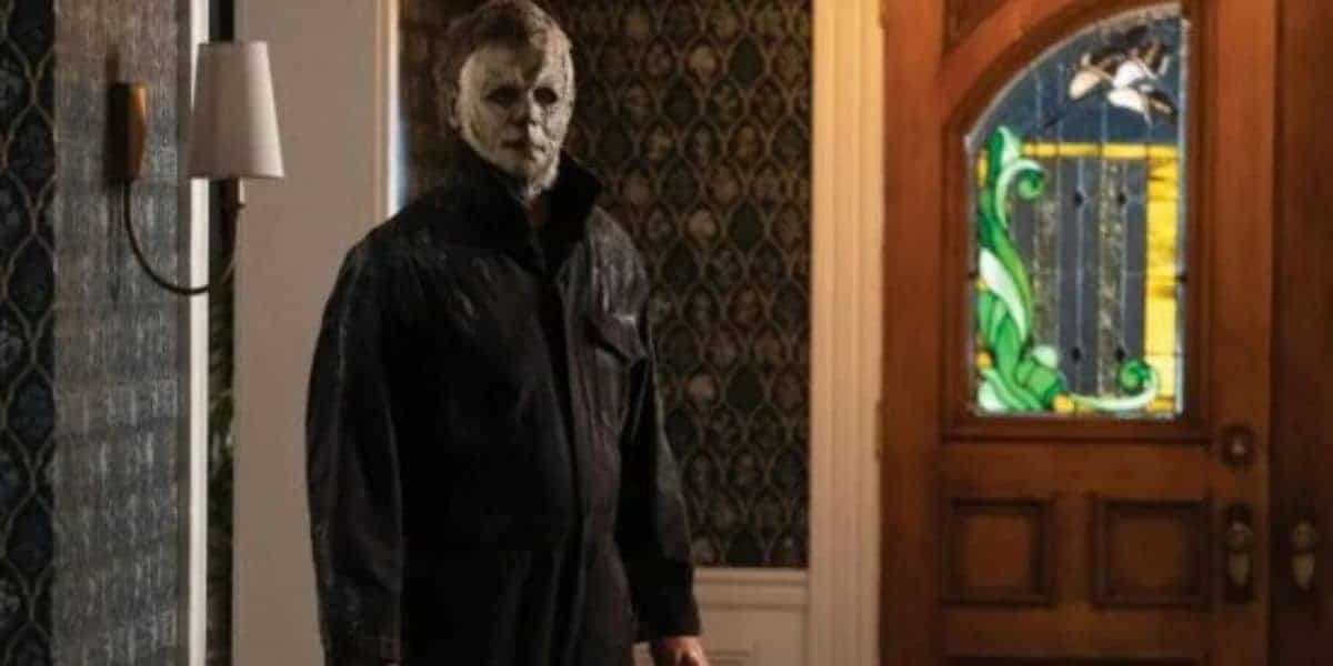 Michael Myers from Halloween (1978) standing in a hallway.