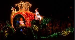 Cinderella in her glowing pumpkin carriage during the Magic Kingdom night parade.
