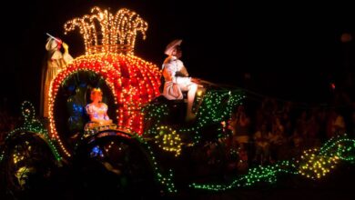 Cinderella in her illuminated pumpkin carriage during a Magic Kingdom passholder parade.