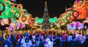 Christmas at Main Street, U.S.A. in Disney World, featuring the holiday tree and festive wreaths.