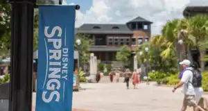 Guests stroll through the Disney Springs shopping district.