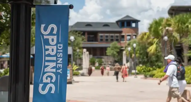 Guests stroll through the Disney Springs shopping district.