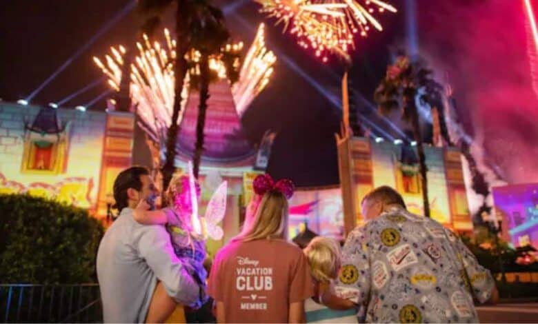 A family watches fireworks at Disney World during their Disney Vacation Club stay.