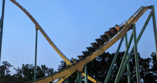 Coaster train ascending the lift hill of Goliath at Six Flags Over Georgia