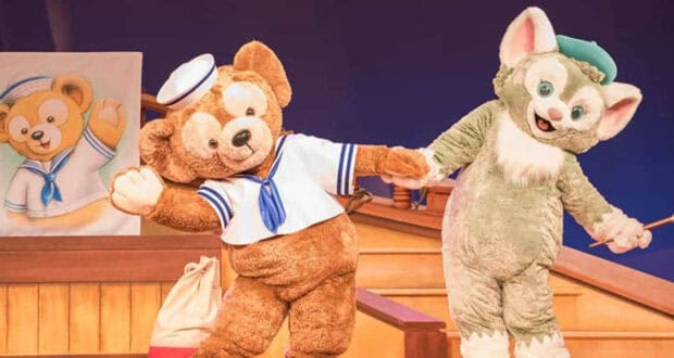 Duffy the Disney Bear and Gelatoni perform on stage during a Disney Cruise Line character breakfast.