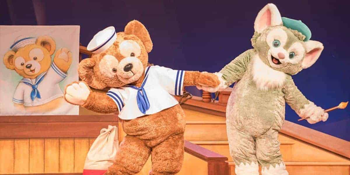 Duffy the Disney Bear and Gelatoni perform on stage during a Disney Cruise Line character breakfast.