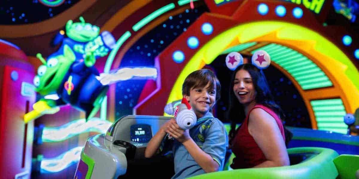 Guests on Buzz Lightyear’s Space Ranger Spin at Magic Kingdom.