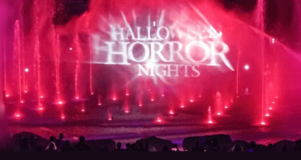 Halloween Horror Nights logo projection on a red fountain show at Universal Studios Hollywood.