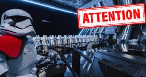 First Order stormtroopers in a Rise of the Resistance hangar with an “ATTENTION” sign overlay.