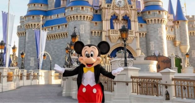 Mickey Mouse at Cinderella Castle in Magic Kingdom.