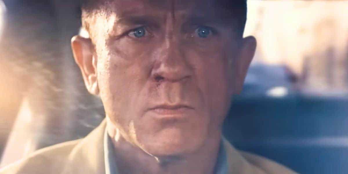 James Bond with a serious expression behind the wheel in the new James Bond film.