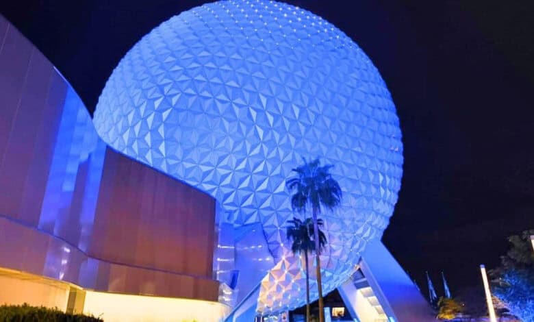 Spaceship Earth at EPCOT glowing at night.