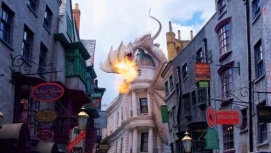 The Ukrainian Ironbelly dragon breathing fire atop Gringotts Wizarding Bank at The Wizarding World of Harry Potter.