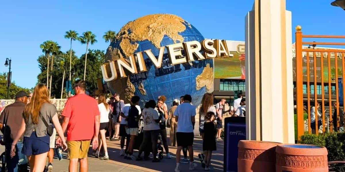 Visitors walk toward the Universal Studios globe during a lockdown.