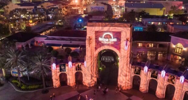 Universal Studios Florida entrance lit up for Halloween Horror Nights, a scene subject to guest removal policies.