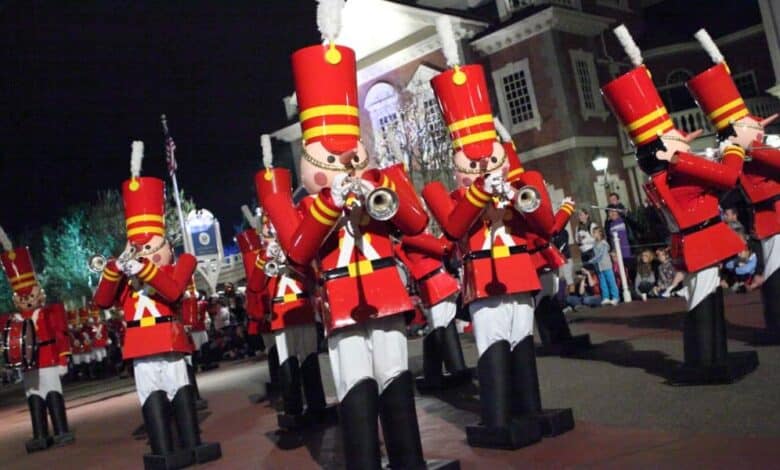 Toy soldiers march and play trumpets in Mickey’s Once Upon a Christmastime Parade at Disney World.