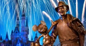 The Partners statue of Walt Disney and Mickey Mouse in front of Cinderella Castle during the Disney World fireworks display.
