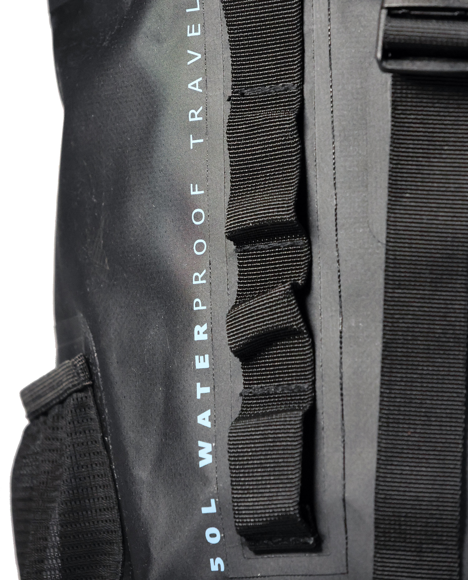 Close-up of waterproof backpack with durable straps and material.