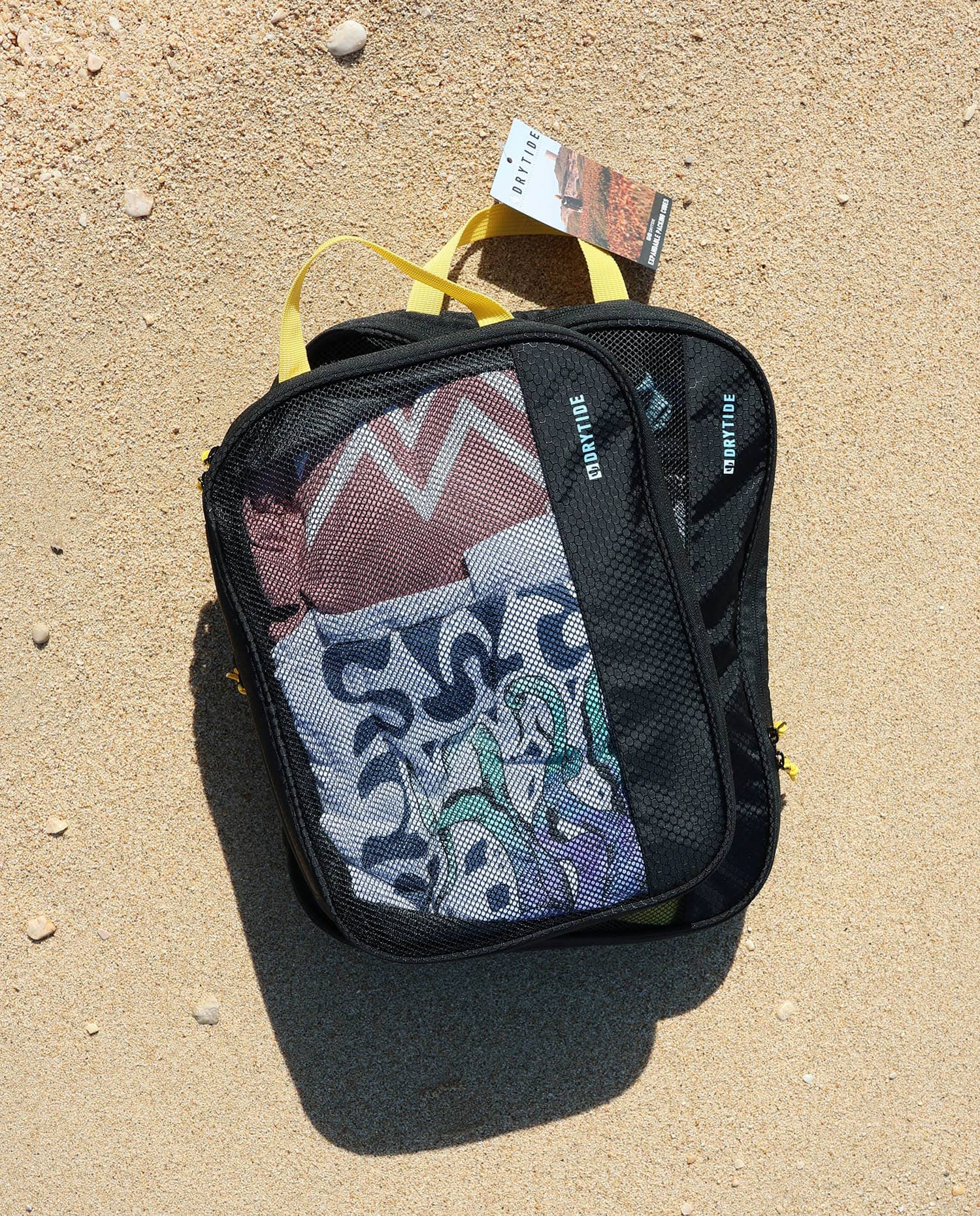 Drytide Waterproof Backpack on Sand Expandable packing cubes on the beach