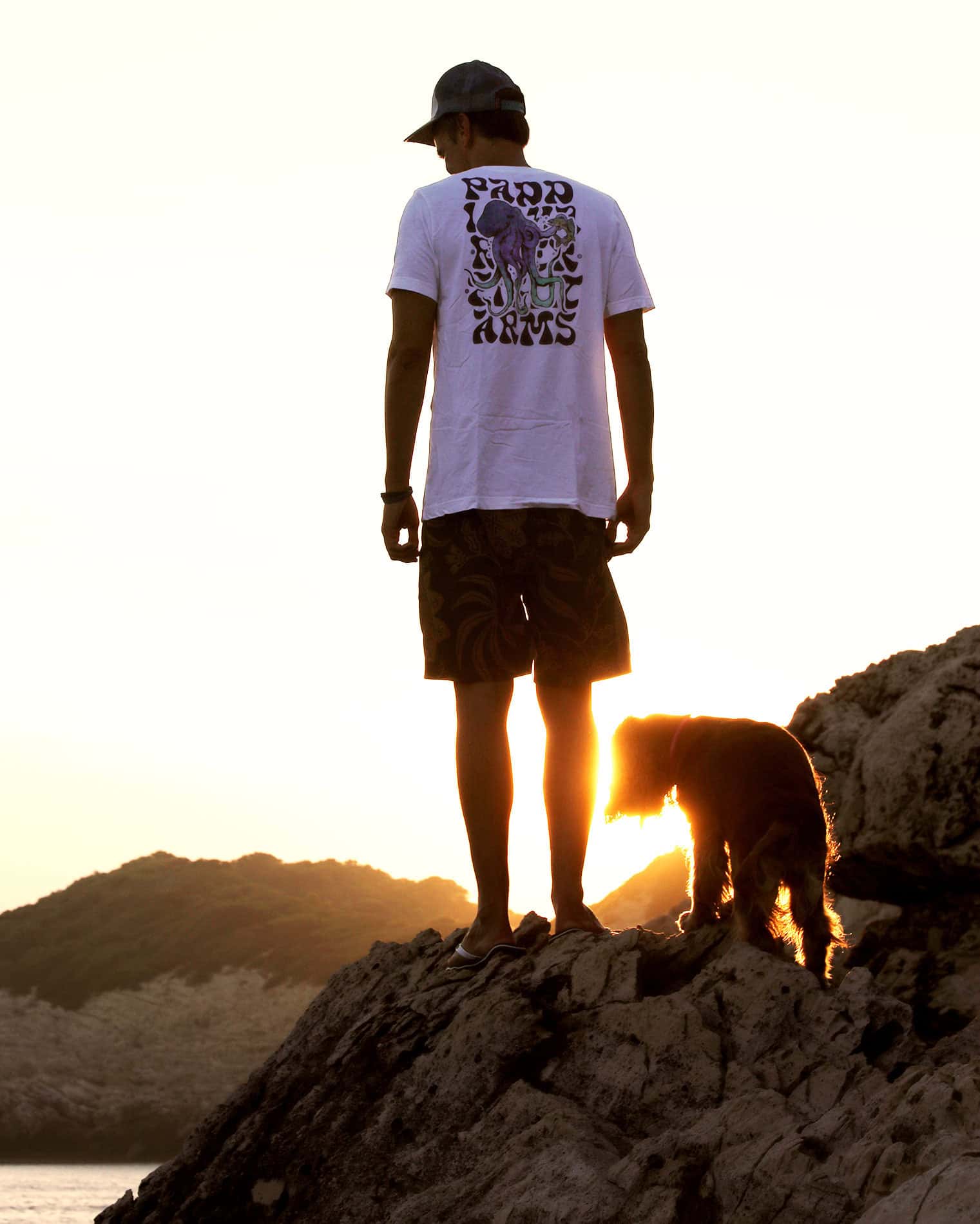 Waterproof Backpack and Dog on Rocks at Sunset kraken octopus tee at sunset