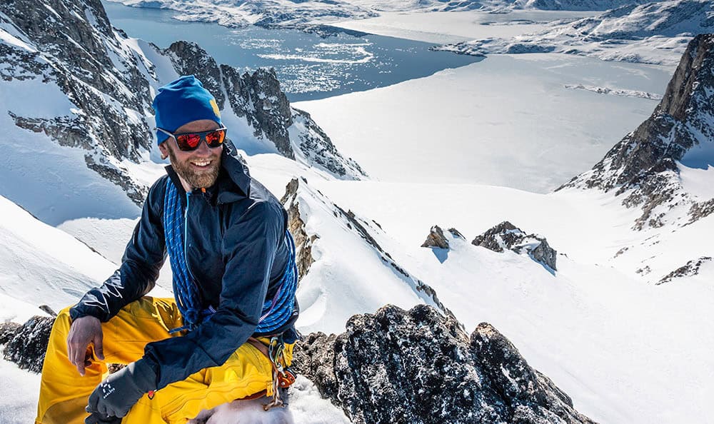Portrait of Matt Spenceley on top of the mountain in East Greenland. Photo by Pirhuk