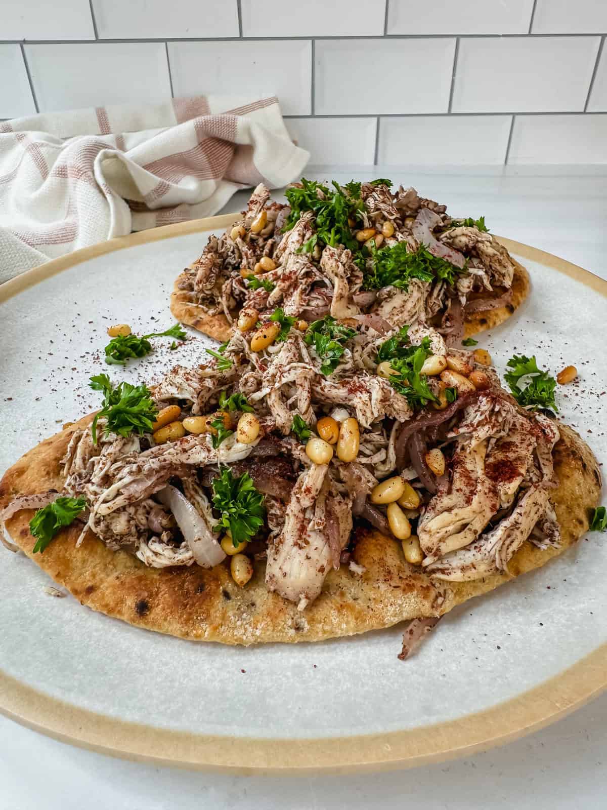 This is a side view close up of the chicken musakhan flatbread recipe