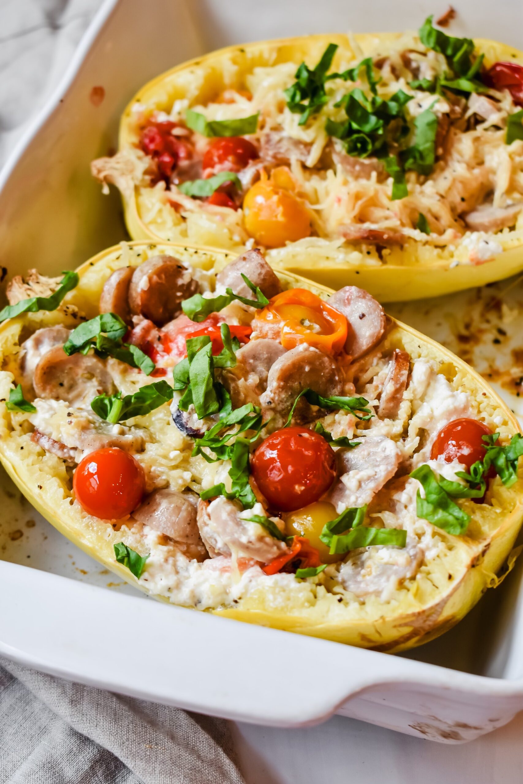 This is a side view close up of my easy viral feta baked spaghetti squash in the casserole dish. 