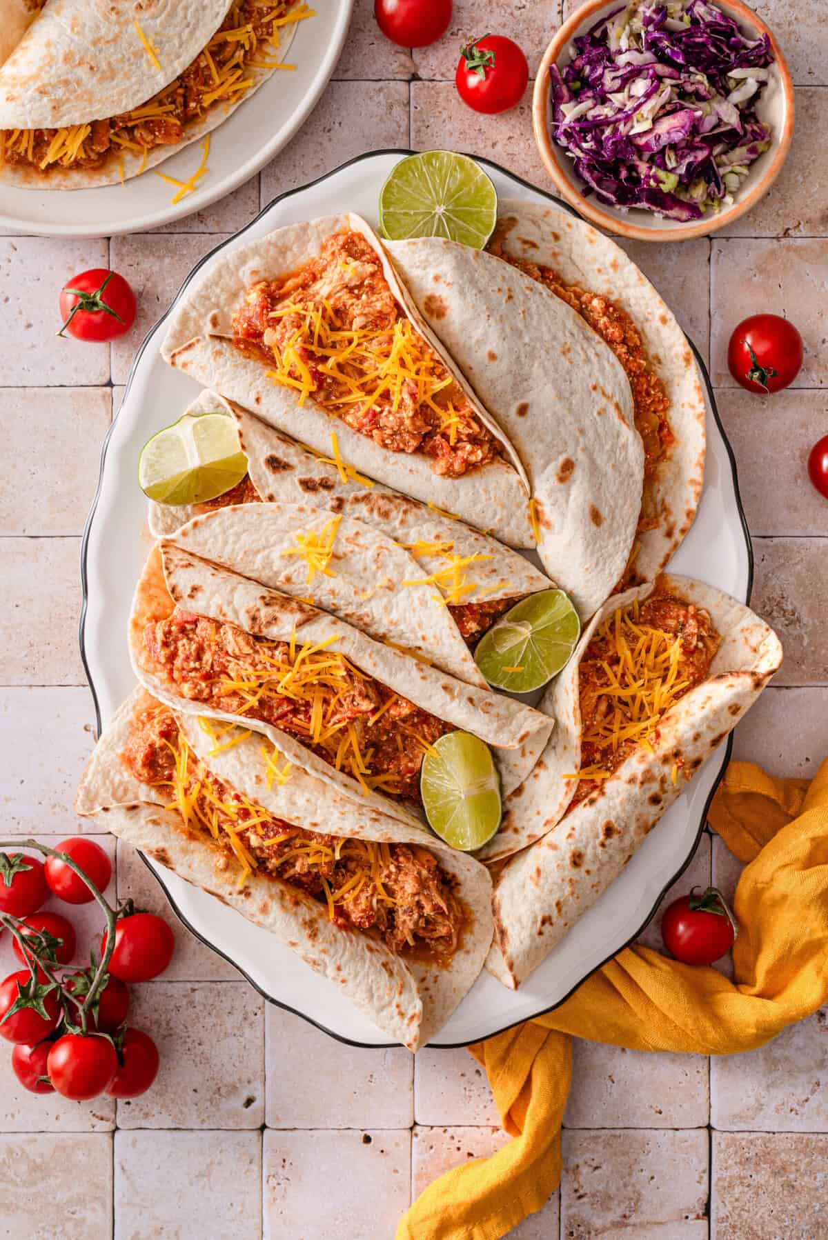 this is another top view of all the tacos on a large plate.