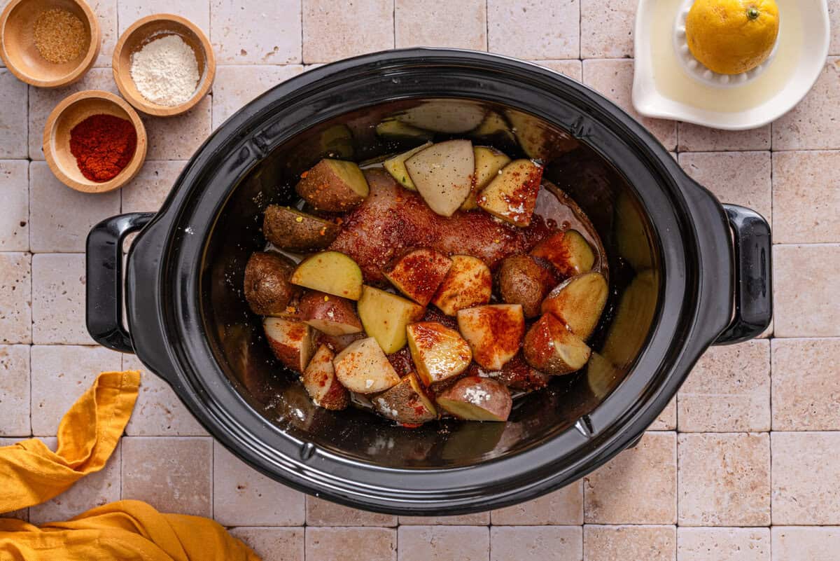 this shows me adding the potatoes on top of the chicken 