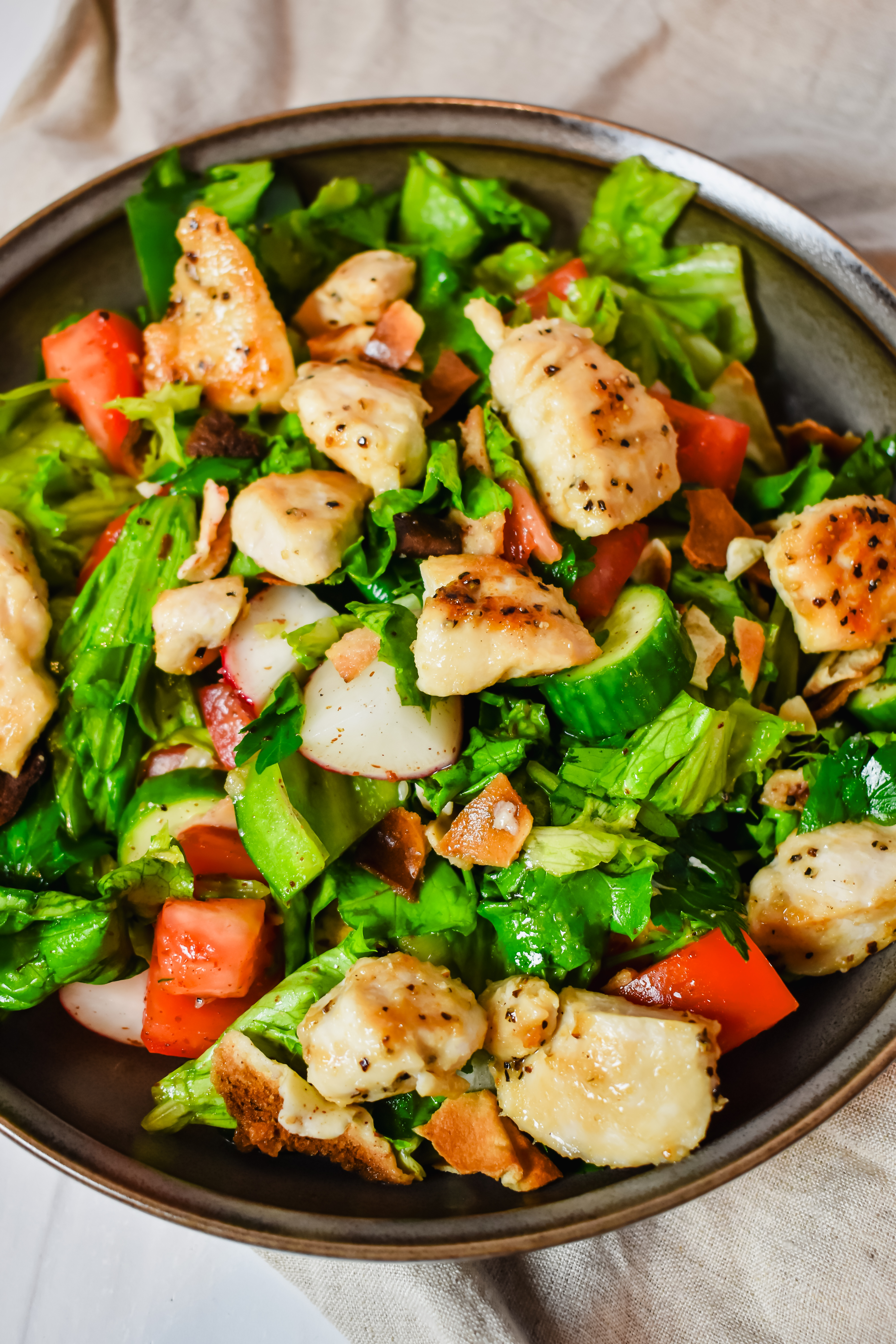 This is a top view close up of my chicken fattoush salad in a bowl.