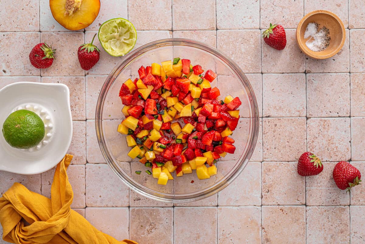 this shows me making the strawberry salsa