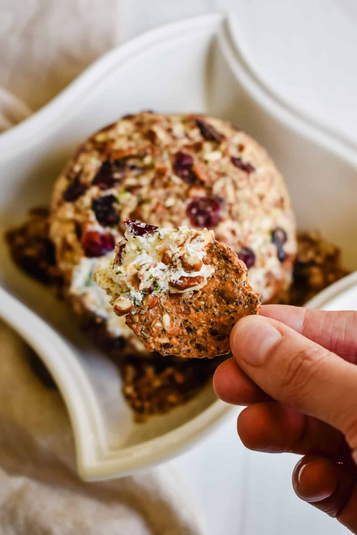 this is a close up of my cranberry cheeseball dipped in a cracker. 