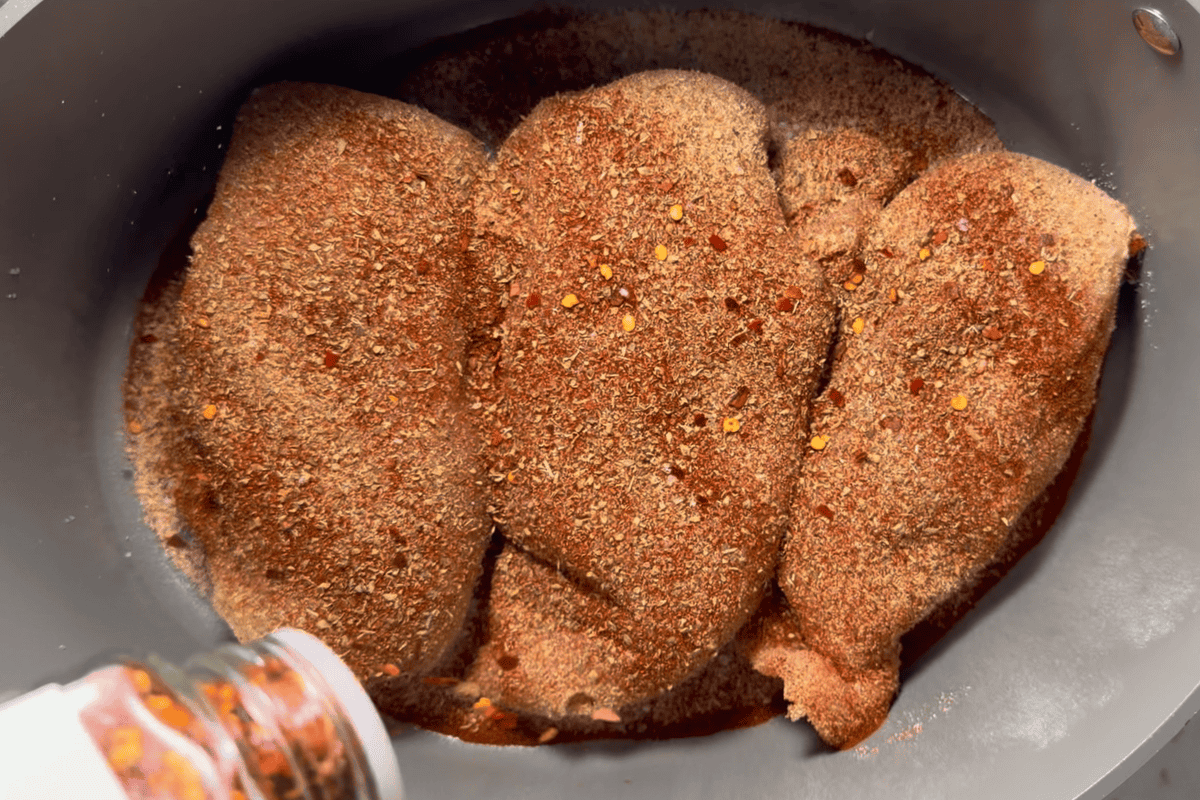 Seasoning the chicken with all my condiments.