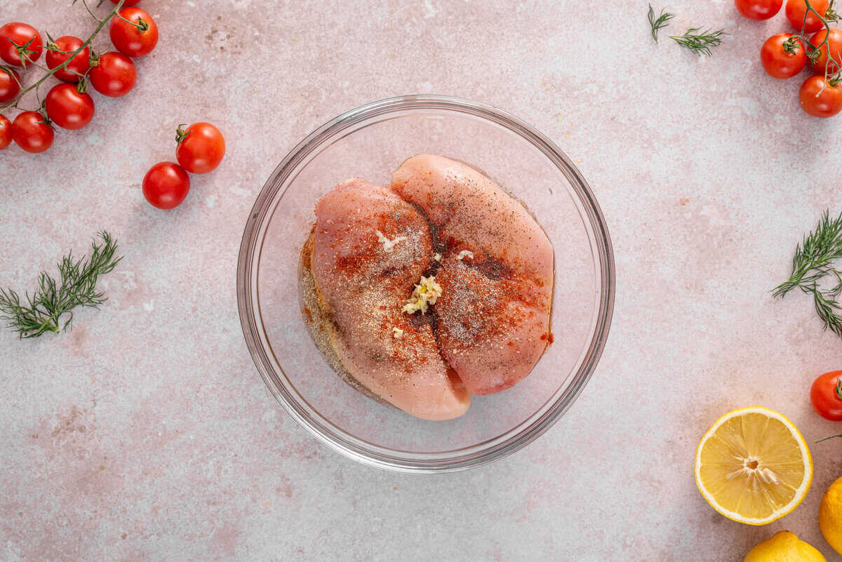 this shows me marinating my chicken in a bowl