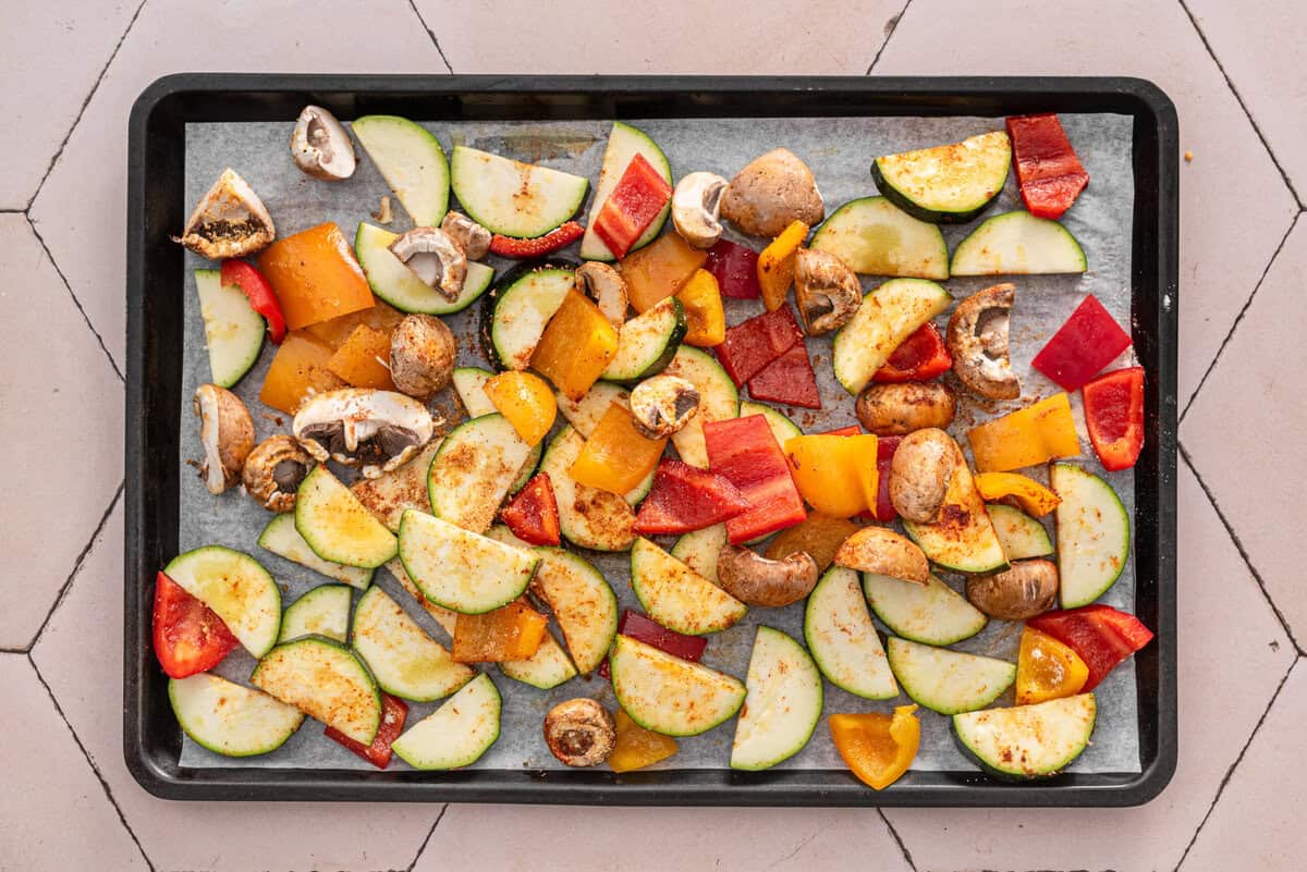 Picture of veggies on baking sheet as step one says to do.