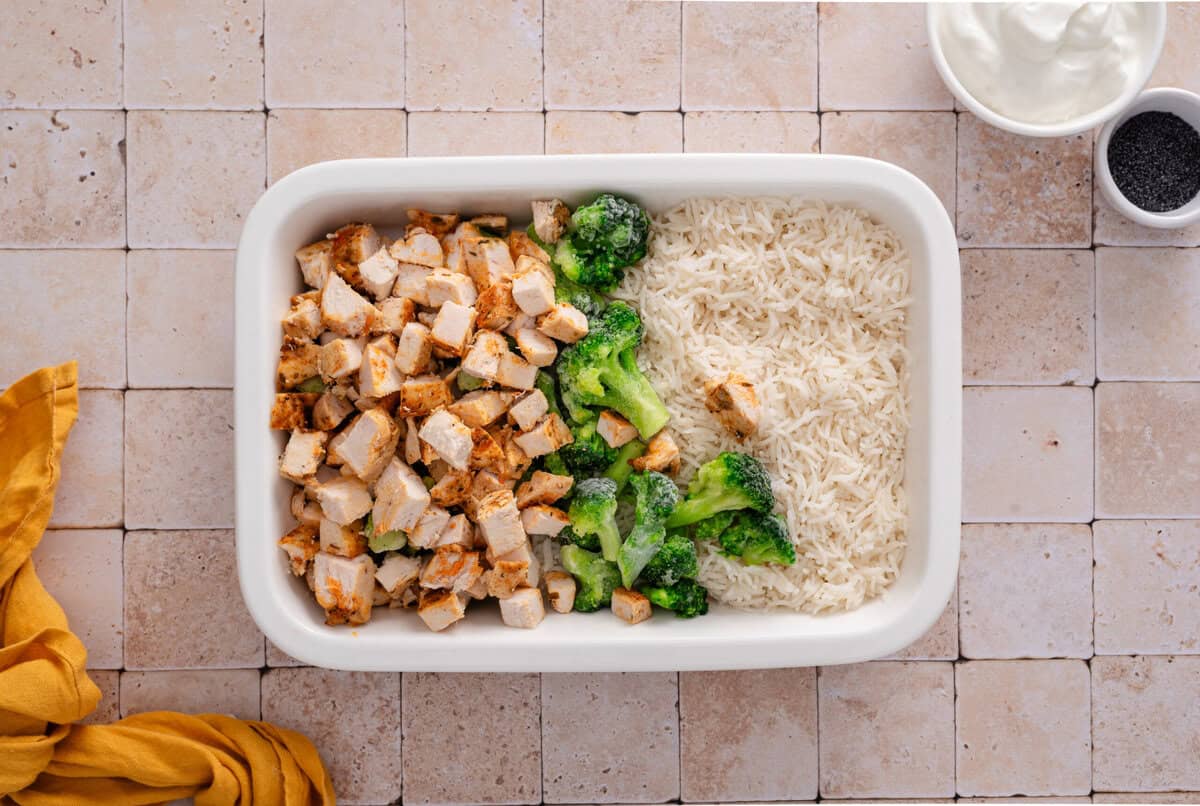 chicken, broccoli and cooked rice in a pan